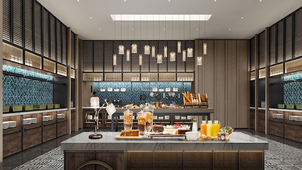 A modern breakfast bar with a variety of food and drinks, wooden paneling, and a patterned backsplash. - Four Points by Sheraton Chengdu, Chunxi Road (Chengdu)