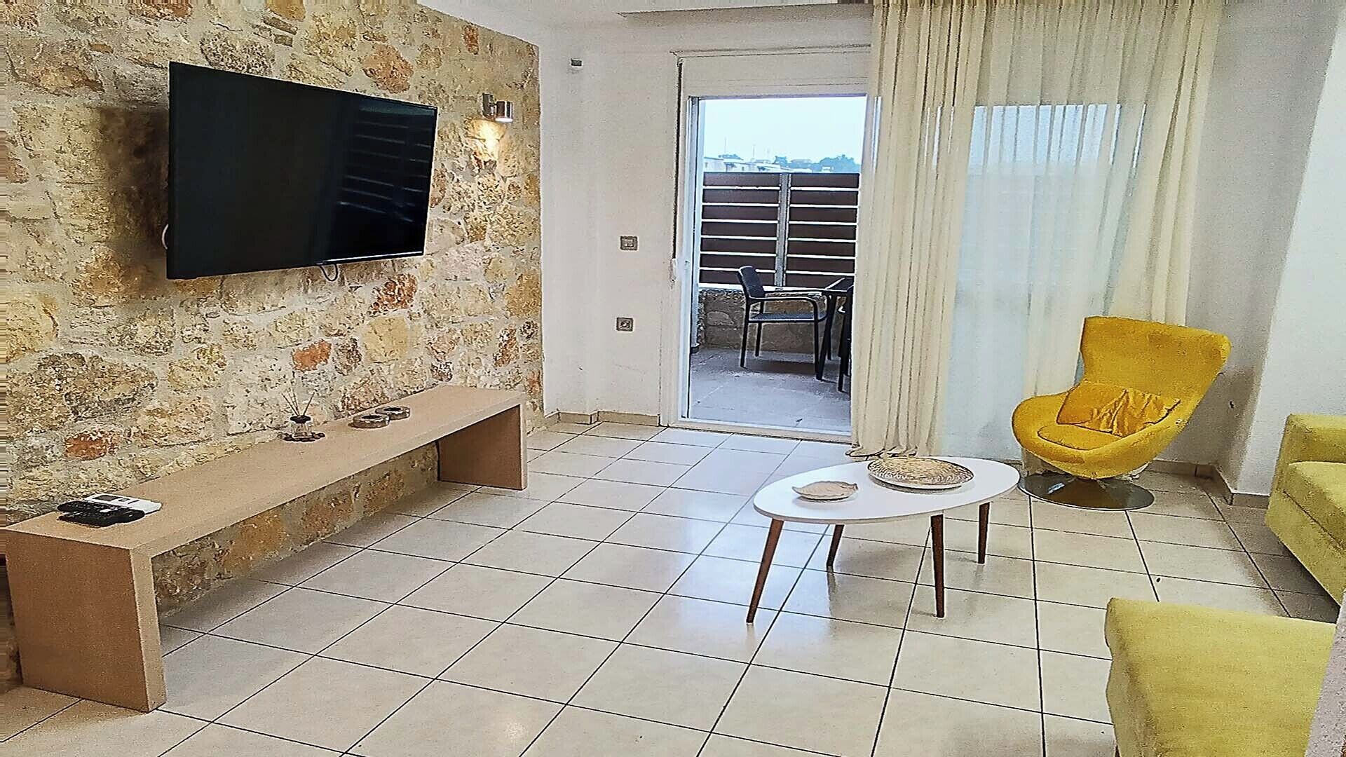 Family Apartment | Living area | 32-inch Smart TV with digital channels