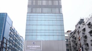 A modern building with a large sign for Vivianna Banquet and Transitel Boutique Hotel. - Transitel A Boutique Hotel (Barasat)