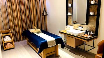 Relax in a serene space with a neatly made bed, wooden vanity, and ample storage.