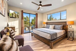 Upper King Guest Suite with ceiling fan, smart TV, and views