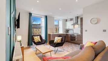 Apartment, City View | Living area | 29-inch TV with satellite channels