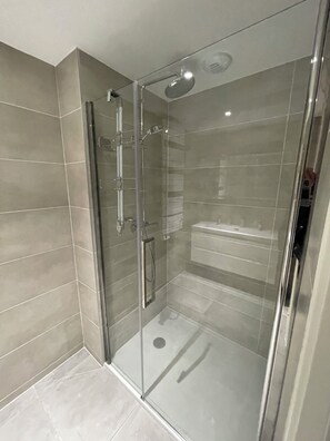 Shower, hair dryer, towels, soap