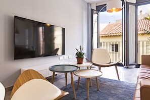 Comfort Apartment, City View | Living area | 70-inch LCD TV with cable channels