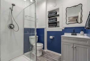 Shower, hair dryer, towels, soap