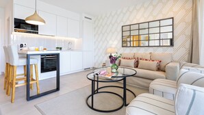 A modern living space with a kitchen, dining area, and seating area. - Genteel Home Ricardo Soriano Terrace (Marbella)