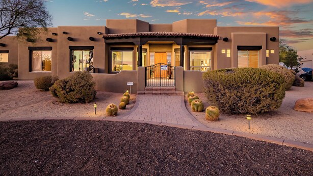 A modern building with a flat roof, large windows, and a covered entrance. - 5BR, Pool, Patio, Outdoor TV & In-Pool Hoops (Scottsdale)