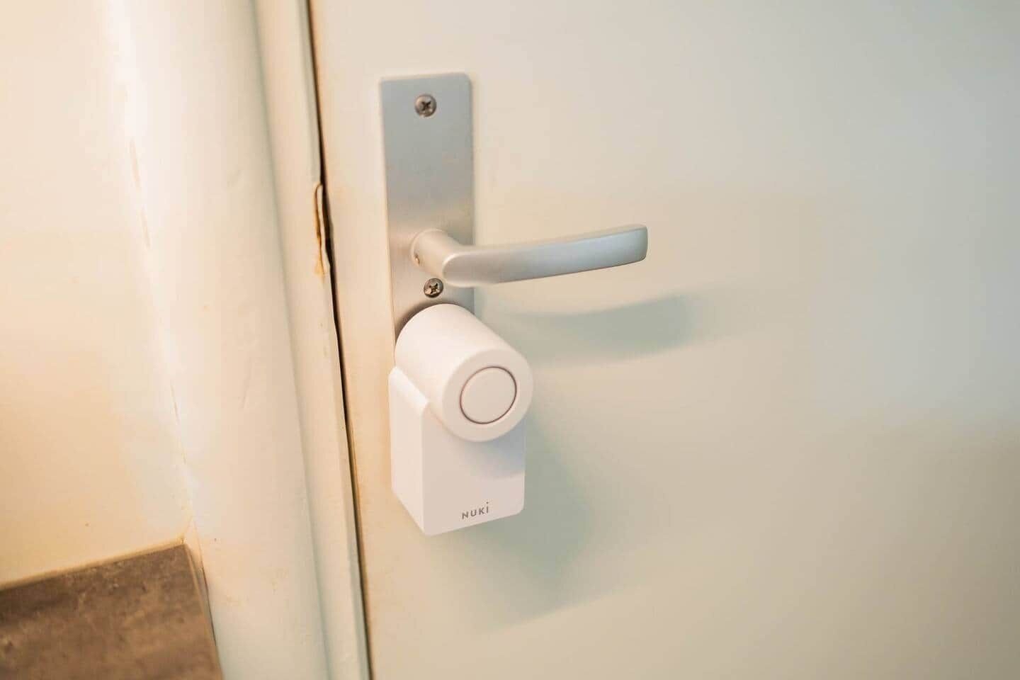 A door with a modern lock and a handle.