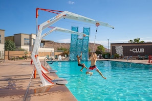 A swimming pool with a slide and a climbing wall, surrounded by lounge chairs and a building labeled 'the CLUB'. - Villa #24 At Bloomington Country Club 4 Bedroom Townhouse (St. George)