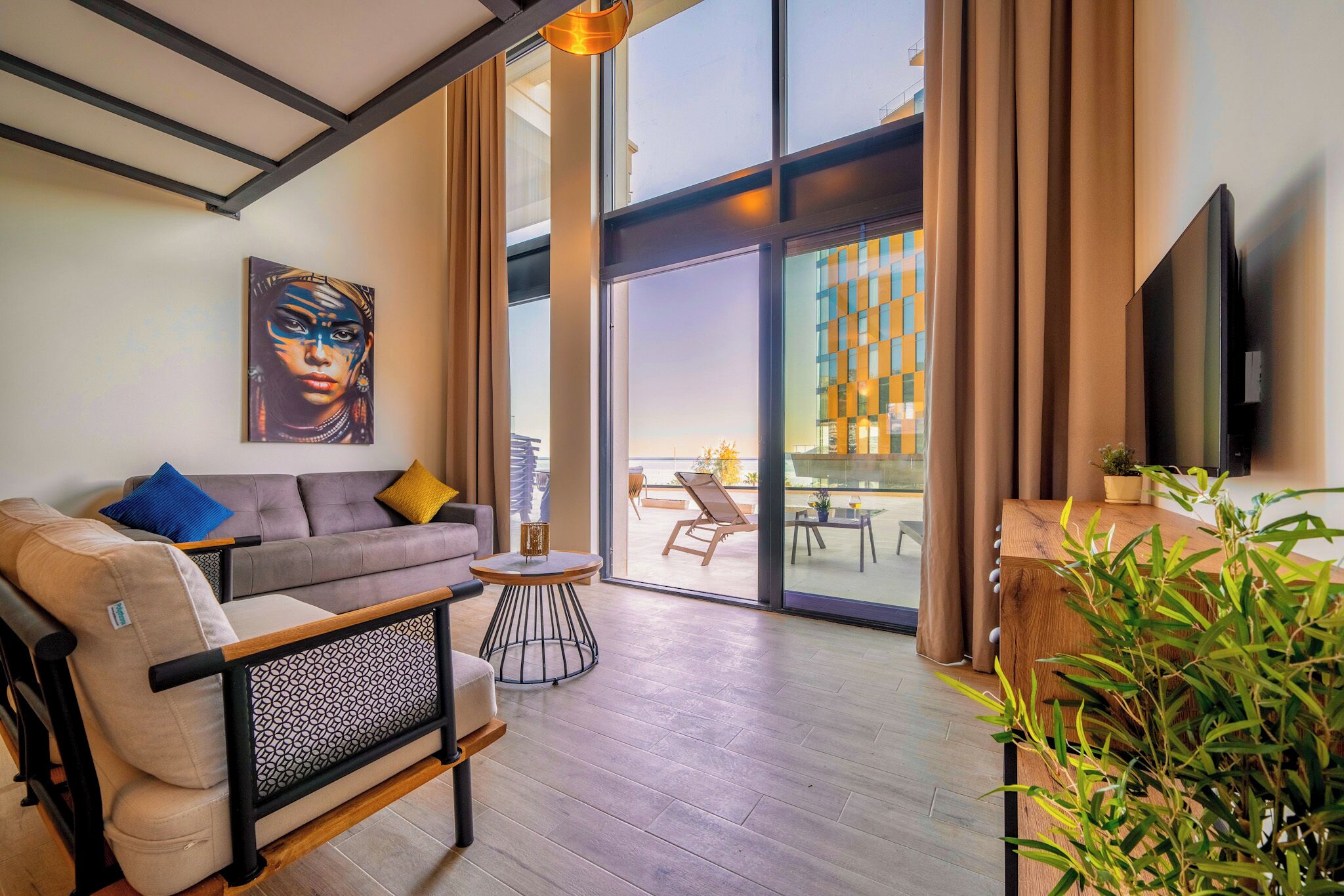 Deluxe Duplex | Living area | 43-inch Smart TV with cable channels