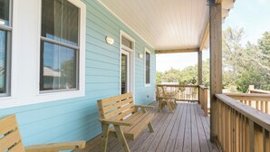 A wooden deck with benches and a covered porch area. - DC51: Walter's Watch - Brand New Construction (Ocracoke)