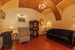 Family Room, Courtyard View | Living area | Fireplace, heated floors - Spa Beerland - At The Golden Lamb (Plzen)