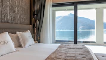 Suite Junior, terrazzo, vista lago | 1 camera, una cassaforte in camera, Wi-Fi gratuito