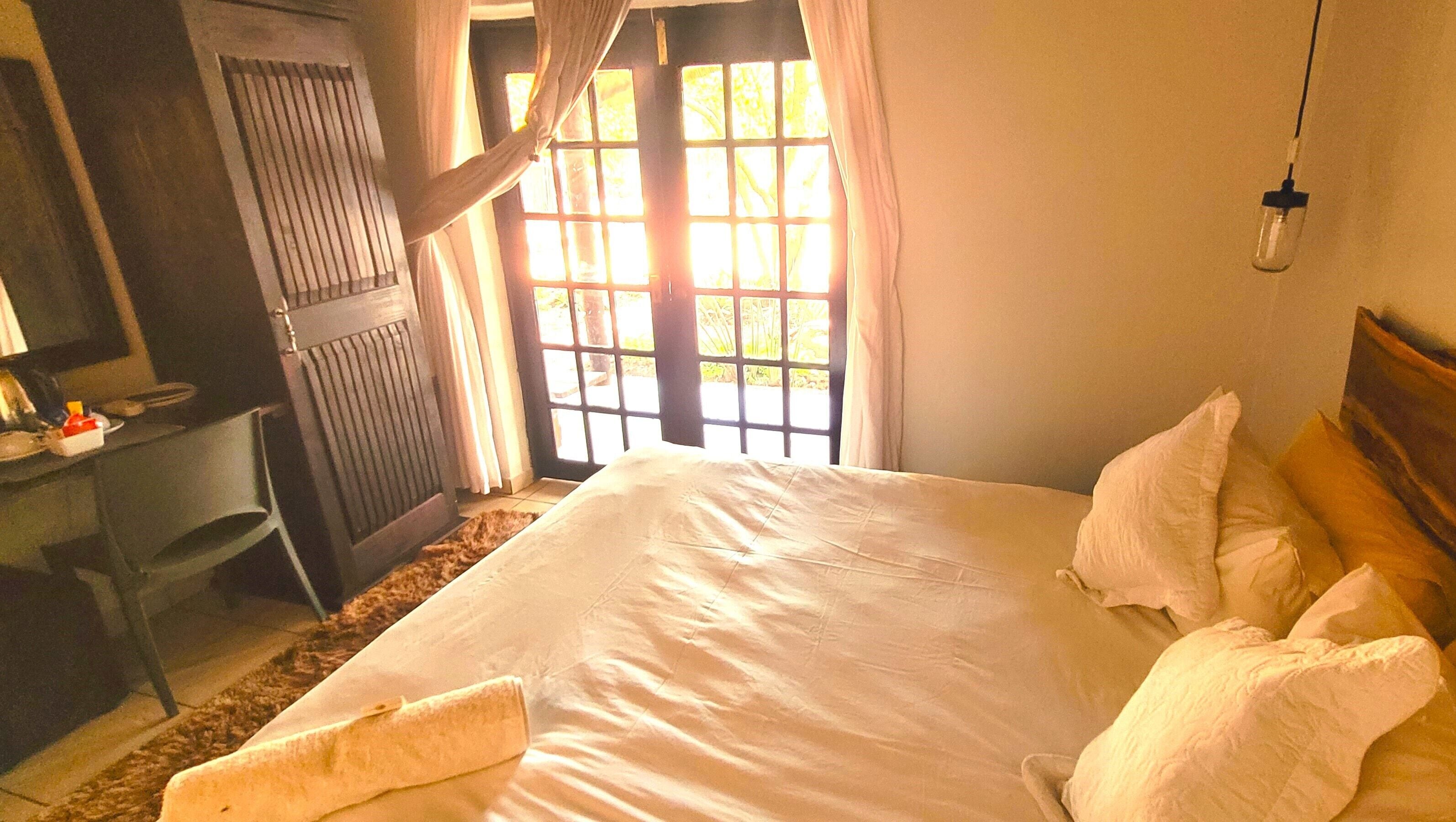 Deluxe Suite, Mixed Dorm, Garden View | Iron/ironing board, free WiFi