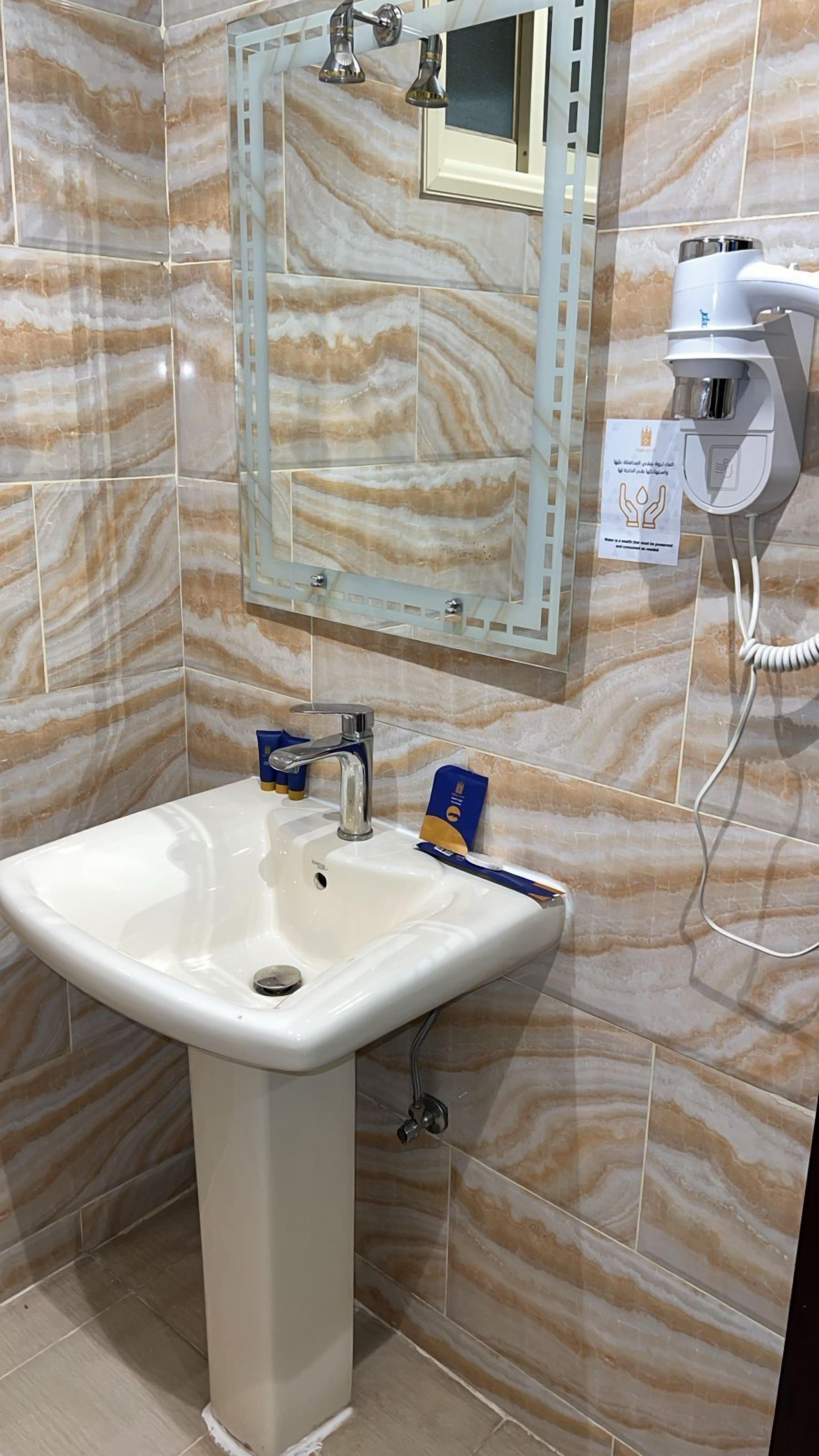 Hair dryer, towels, soap, shampoo