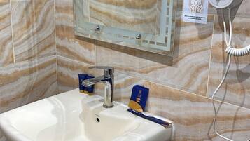 Hair dryer, towels, soap, shampoo