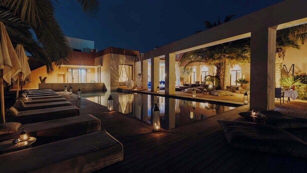 A serene evening poolside area with lounge seating and ambient lighting. - The Garden of Siredrah, an Oasis with Pool and Hammam (Marrakech)