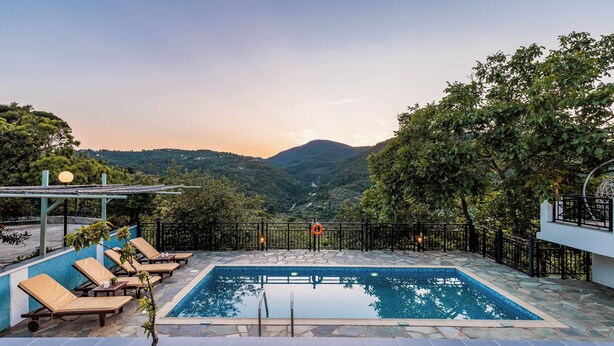 A swimming pool with lounge chairs and a view of mountains. - Villa Augusta - Two Bedroom Villa, Sleeps 4 (Sporades)