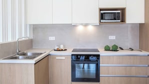 A modern kitchen with a built-in microwave, stainless steel sink, and a dishwasher. - Villa Averto Anna - Two Bedroom Villa, Sleeps 4 (Rachi)