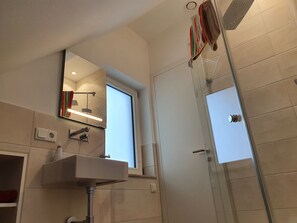 Shower, hair dryer, towels, soap