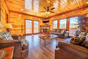 TV, fireplace - *HUGE 4BD Lodge w/ POOLS! Hot Tub + Theater!* (Gatlinburg)
