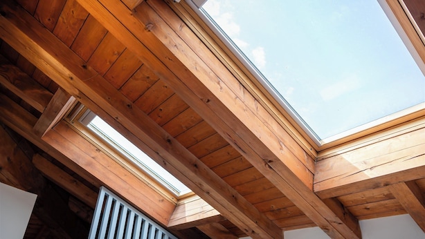 A room with wooden beams, skylights, and a white wall. - RossoVino Milano Boutique (Milan)