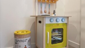 A children's play kitchen with a shape sorting lid and wooden blocks. - Lovely 2 Beds Apt with City View at South Brisbane (South Brisbane)