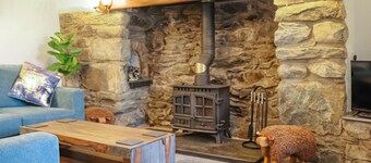 A charming cottage with distant sea views, in a peaceful setting.