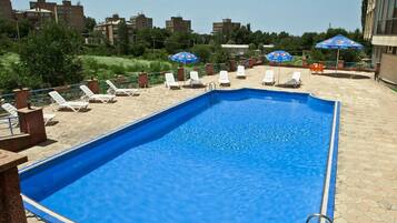 Seasonal outdoor pool, pool umbrellas, sun loungers