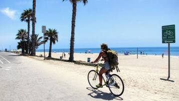 On the beach, sun loungers, beach towels