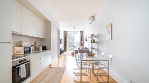 Fridge, microwave, oven, stovetop - Chic 1BR in República w/ Balcony by LovelyStay (Porto)