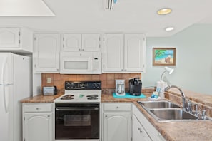 Fridge, microwave, oven, stovetop - 407 – Beachfront 2BR Escape | Large Balcony & Free Beach Service (Panama City Beach)