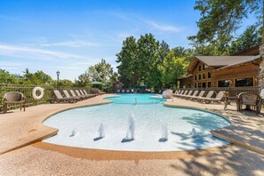 Relax by the pool surrounded by a natural setting and comfortable lounge chairs.