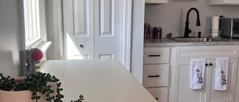 Fridge, microwave, stovetop, coffee/tea maker