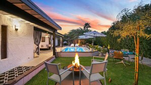 A backyard with a pool, outdoor seating, and a fire pit. - The Colony Enclave - #1 Hideaway in Palm Springs (Palm Springs)
