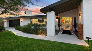 A modern house with a garage, a covered porch, and a landscaped garden. - The Colony Enclave - #1 Hideaway in Palm Springs (Palm Springs)
