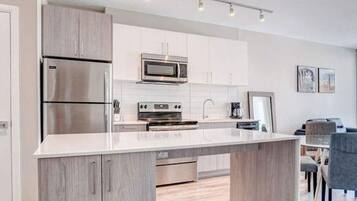 Coffee/tea maker, fridge, microwave, oven