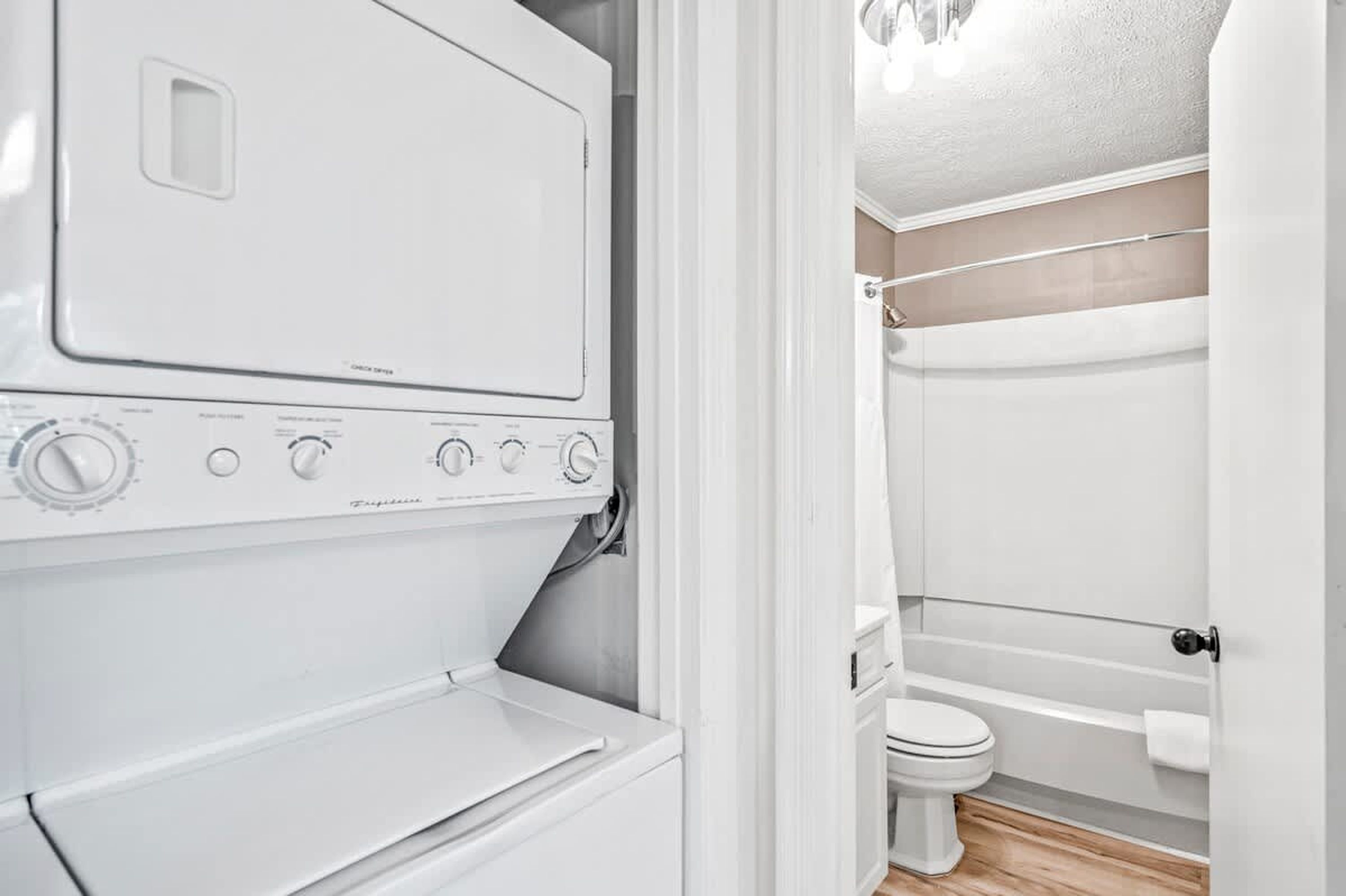 A laundry room with a front-loading washing machine and dryer.