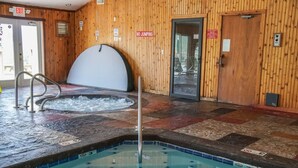 An indoor swimming pool with a wooden wall, a hot tub, and a no-jumping sign. - Indoor Pool Access Full Kitchen Mountain Views (Gatlinburg)