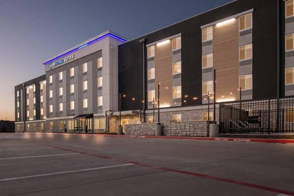A modern hotel building with a sign reading "Everhome Suites." It features a large parking lot and a stone facade. - Everhome Suites Waco by Choice Hotels (Waco)