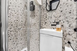 Shower, hair dryer, towels, soap