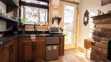 Fridge, coffee/tea maker, toaster, cookware/dishes/utensils