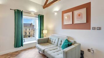 Apartment, City View | Living area | 30-inch TV with cable channels