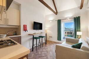 Apartment, City View | Living area | 30-inch TV with cable channels