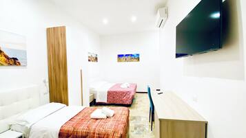 Comfort Quadruple Room | Minibar, individually decorated, individually furnished, desk
