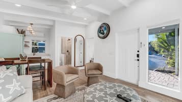 Deluxe Single Room | Living area | 55-inch Smart TV with cable channels, streaming services