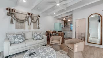 Deluxe Single Room | Living area | 55-inch Smart TV with cable channels, streaming services