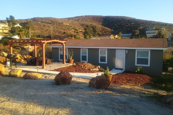 Front of Casa Monte Mar and front patio with fire pit. Amazing views at night!