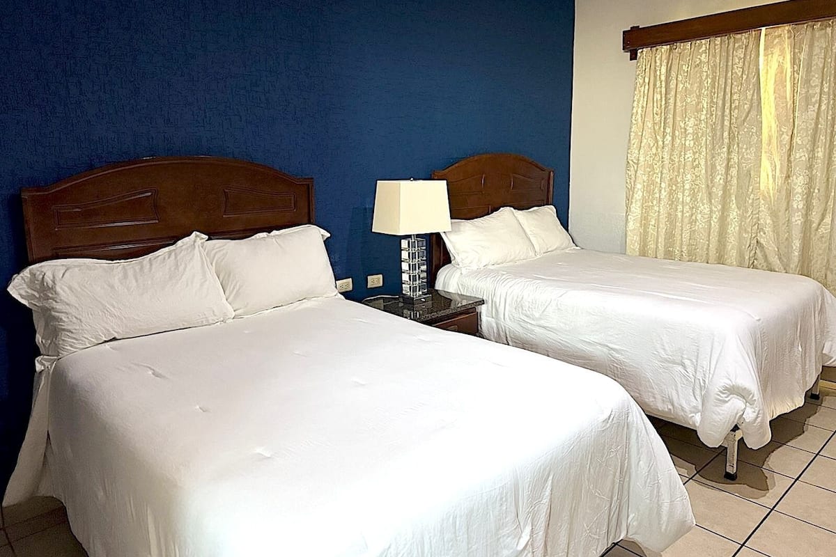 Blackout curtains, iron/ironing board, free WiFi, bed sheets