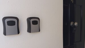 A door with a numeric keypad and a doorbell. - Number Four  (Brighton)
